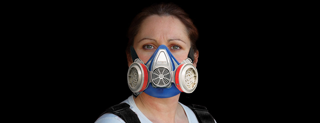 Female firefighter with elastomeric half-mask respirator